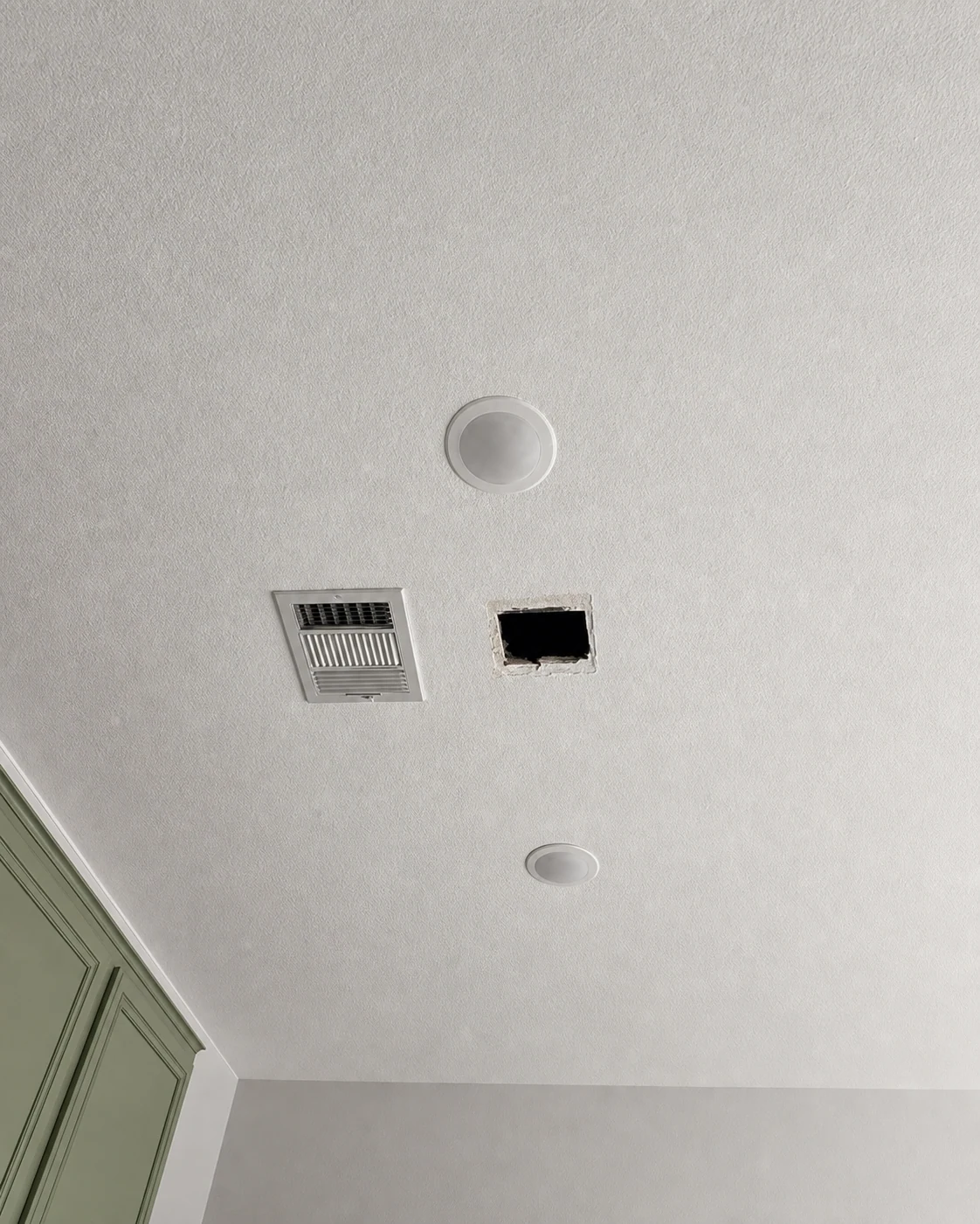 Professionally restored Moyeda field photo of an open ceiling access cutout beside an HVAC vent