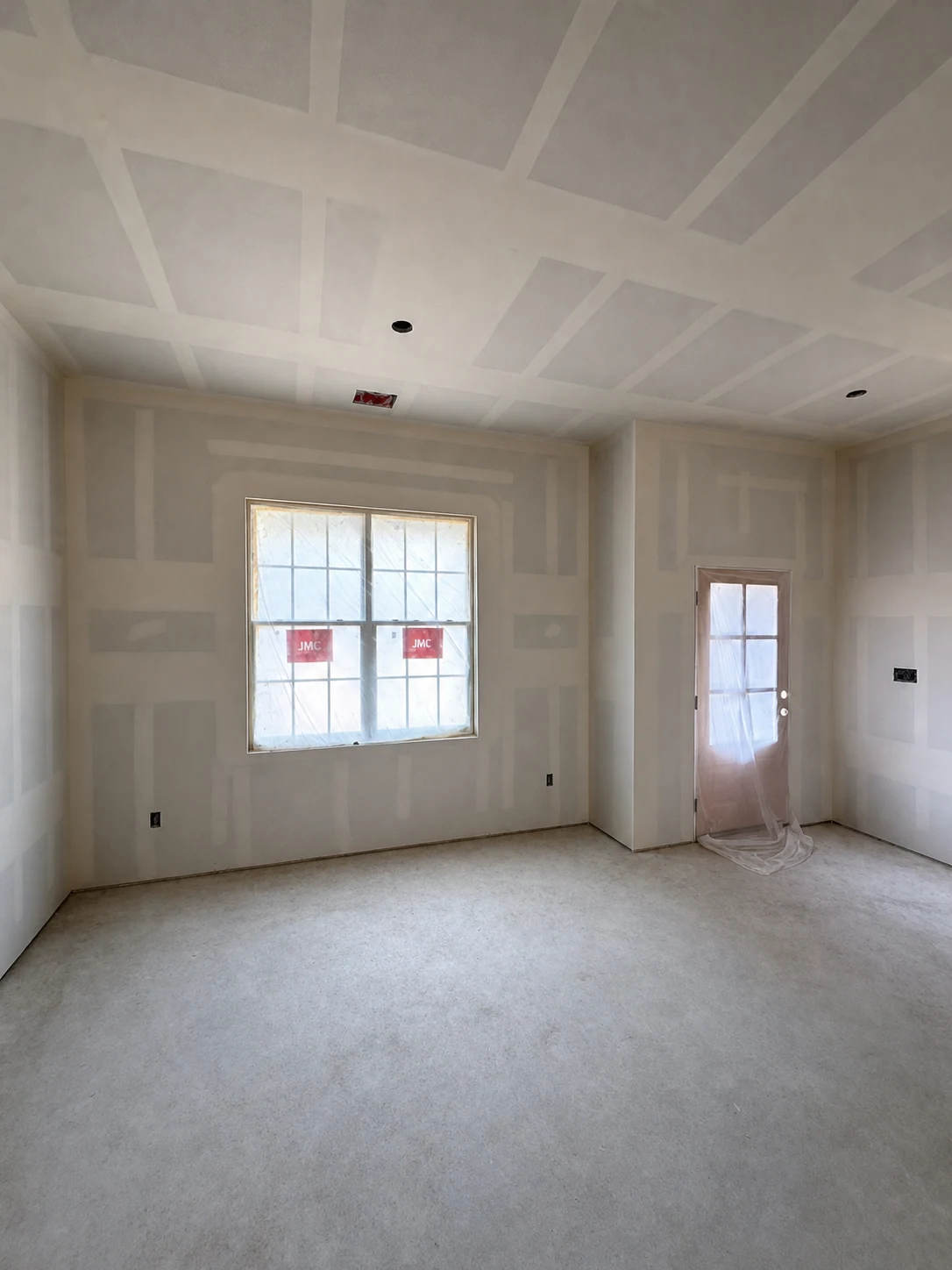 Window-room drywall installation by Moyeda Construction Group
